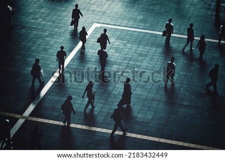 Silhouette of a person walking in the city
