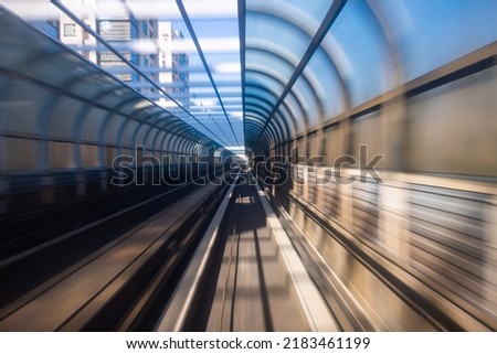 Motion blur of train moving inside tunnel Royalty-Free Stock Photo #2183461199
