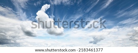 Ornamental clouds. Dramatic sky. Epic storm cloudscape. Soft sunlight. Panoramic image, texture, background, graphic resources, design, copy space. Meteorology, heaven, hope, peace concept Royalty-Free Stock Photo #2183461377