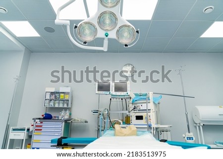 Sterile surgical lamps in operation ward. Modern surgery light in emergency room.
