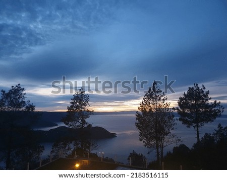 When sunrise in Lake Toba