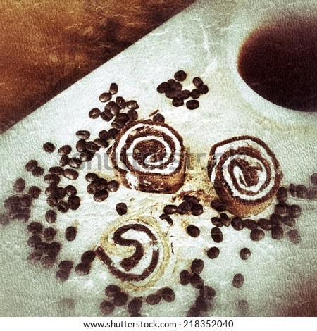 An Old Vintage Photograph of  cake roll and coffee on wooden board 