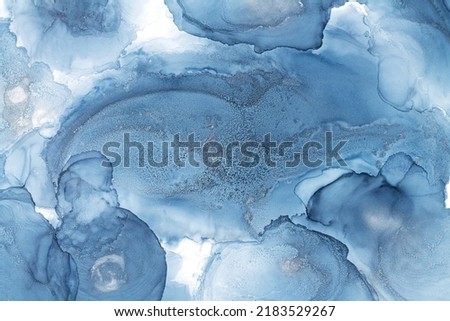 Photo of blue alcohol ink abstract texture or modern fluid art background