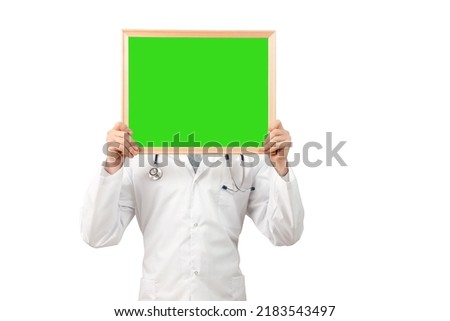 Medical services. Portrait of a young doctor with a stethoscope. Doctor showing mock up empty signboard. Medical Concept. Copy space.