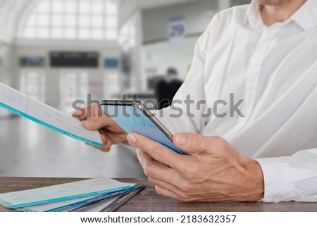 Closeup photo of traveling man searching flight schedule for international travel