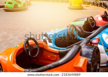 A row of dodgem cars. Autodrome in the amusement park. Royalty-Free Stock Photo #2183644889