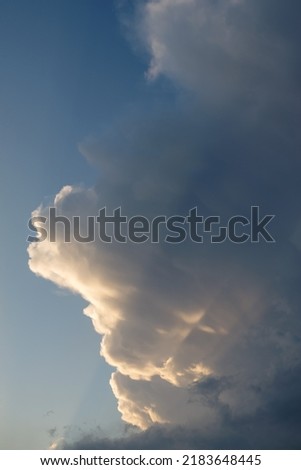 Cumulus partly spreading with ominous stormy weather Royalty-Free Stock Photo #2183648445