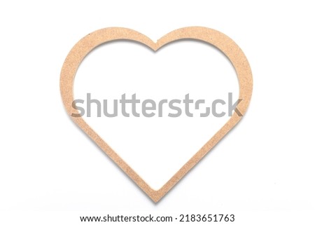 Wooden heart shaped picture frame isolated on white background