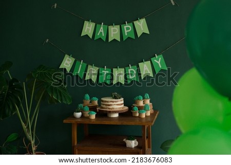 Birthday party table decoration, Happy Birthday inscription and baking