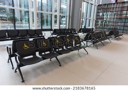 Reserved seats and signs for people with special needs at Istanbul Airport terminal, Turkiye