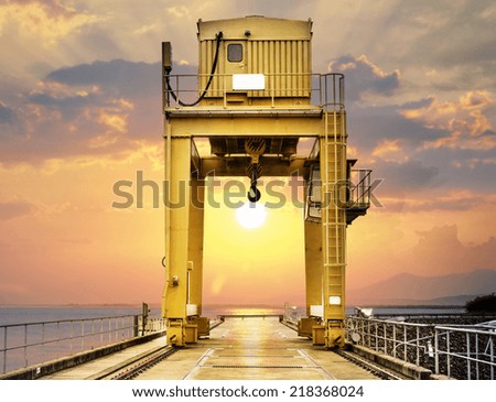 Large Gantry Crane on Sunset at Ubonrat Dam, khonkaen, Thailand Royalty-Free Stock Photo #218368024