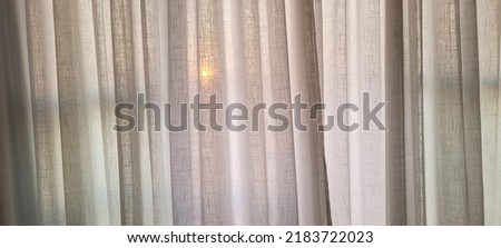 white linen curtain in apartment with a view of the sun in Brazil, with white texture