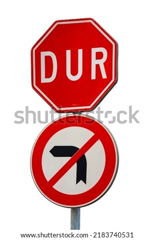Red Stop or DUR sign in Turkish language and 'do not turn right' sign on the power pole. Isolated on white background. Traffic signs and safety concept