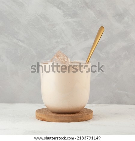 Glass of Healthy Protein smoothie with roasted multigrain powder. Popular Korean breakfast milkshake. Royalty-Free Stock Photo #2183791149