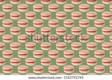 Sweet chocolate macarons,cookies on pink background seamless pattern. Food dessert flatly flat lay of delicious sweet nibbles, pastry, confectionery, tasty sugar food top view.