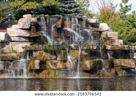 A man-made waterfall at the local wildlife sanctuary enhances its beauty for visitors.