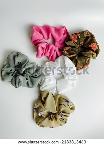 hand made colorful hair ties on a white background