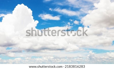 Clean blue sky and white clouds sky background with space for decoration. And used to make wallpaper or bring to work in graphic design.
