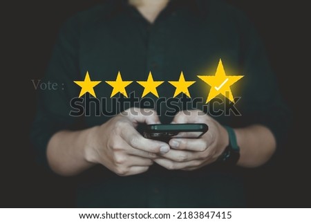 Customer review good rating concept  people use smartphone by five star on visual screen and positive customer feedback testimonial.
