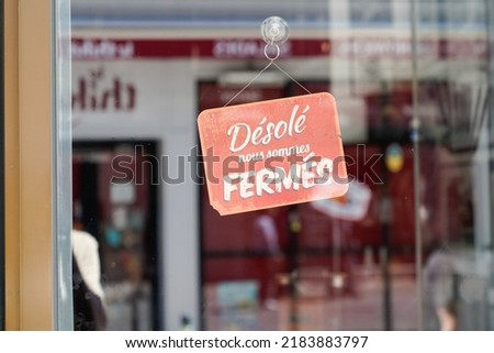 vintage red panel shop sign desole nous sommes ferme french text means sorry we are closed board Royalty-Free Stock Photo #2183883797