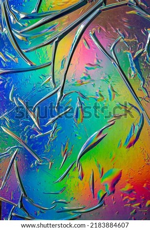 Glued colorful gradient holographic texture background. Dark futuristic blurred hologram colors. Abstract Rainbow foil for poster, cover art, overlay, banner, wallpaper, and print design.