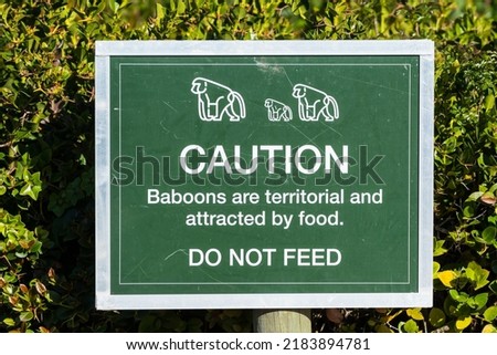 Caution sign or signage do not feed wild animals or baboons in South Africa 