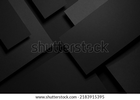 Dark carbon grey abstract geometric background with soar rectangele surfaces with corners, stripes, lines as monochrome stylish backdrop in elegant simple modern minimal style, top view.