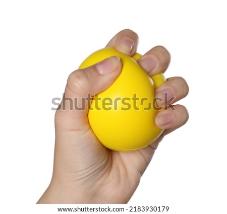 Woman squeezing antistress ball on white background, closeup Royalty-Free Stock Photo #2183930179
