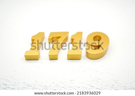    Number 1719 is made of gold painted teak, 1 cm thick, laid on a white painted aerated brick floor, visualized in 3D.                              