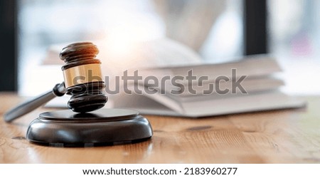 Wooden brown judge gavel on the table, copy space, banner background.