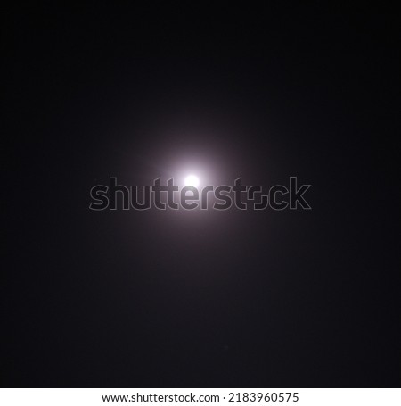 A picture of full moon in dark night 