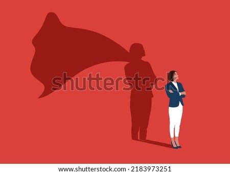 Businesswoman dreams of becoming a superhero. Confident handsome young woman standing superhero shadow concept illustration. Royalty-Free Stock Photo #2183973251