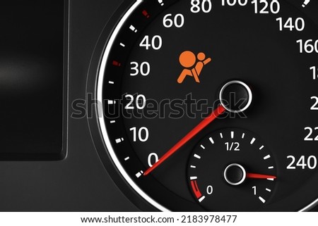 Closeup view of dashboard with warning icon check airbag system in car Royalty-Free Stock Photo #2183978477