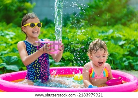 Children swim in the pool. Selective focus. Kid.