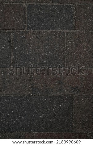 Surface of grunge brown rough paving slabs. Top view. Abstract background texture. Wallpaper template. paving slabs for pedestrian street