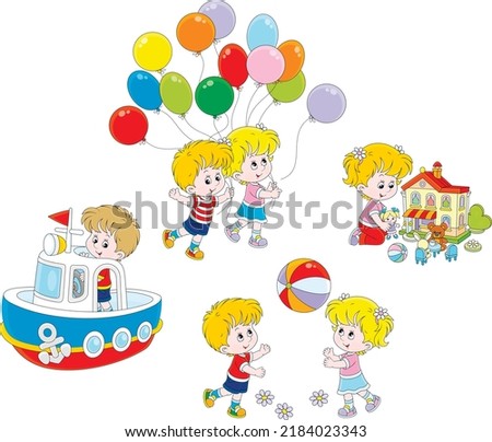 Happy little girl and boy playing a colorful ball, with a dollhouse, a toy boat and balloons