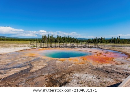 Sunny view of the beautiful Opal Pool at Wyoming