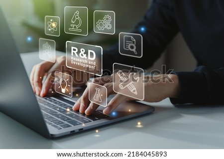 Hand of businessman working to R and D icon for Research and Development on laptop screen, Manage costs more efficiently. R and D innovation concept. Royalty-Free Stock Photo #2184045893