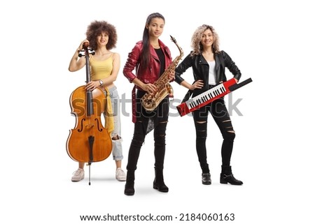Band of young trendy female musicians with a cello, sax and a keytar isolated on white background