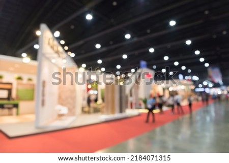Abstract blur people in exhibition hall event trade show expo background. Large international exhibition, convention center, business marketing and event fair organizer concept. Royalty-Free Stock Photo #2184071315