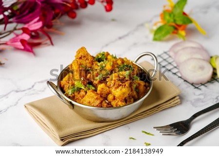 Aloo gobi is a simple vegetarian dish made with potatoes, cauliflower, spices and herbs Royalty-Free Stock Photo #2184138949