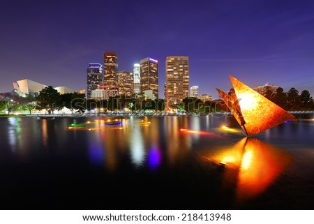 Los Angeles downtown at night with urban buildings and lake