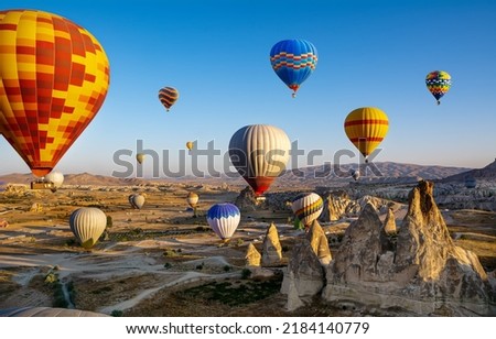 The great tourist attraction of Cappadocia - balloon flight. Cappadocia is known around the world as one of the best places to fly with hot air balloons. Goreme, Cappadocia, Turkey Royalty-Free Stock Photo #2184140779