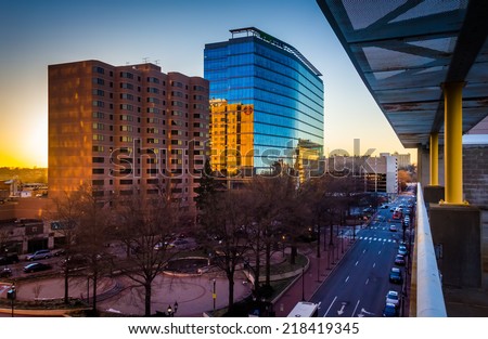 View of buildings along 11th Street at sunset in downtown Wilmington, Delaware, from the City Center Parking Garage. Royalty-Free Stock Photo #218419345