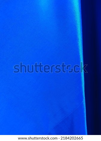 blue curtain under the sunlight  for creative background 