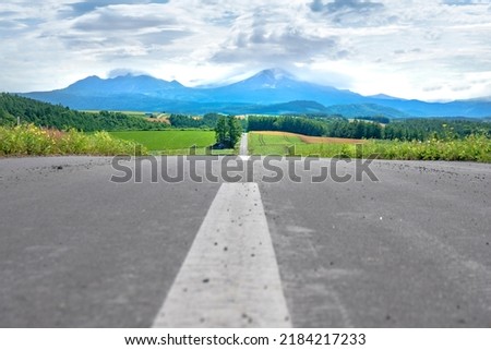 A straight road that goes on forever in Hokkaido Japan