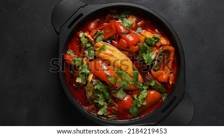 Moroccan fish  with chermoula, red peppers and preserved lemon. Spicy traditional  Moroccan food Royalty-Free Stock Photo #2184219453