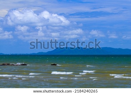 Waves crashing on the beach. Lonely beach and sea of Pattaya Bay, Chon Buri, Thailand. (The pictures has noise and soft focus)