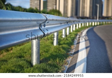 Traffic barrier on bridge highway road.  protect vehicles from accident.  guardrails.  Industrial city background. Royalty-Free Stock Photo #2184249955