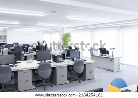 Unattended office with desks and computers